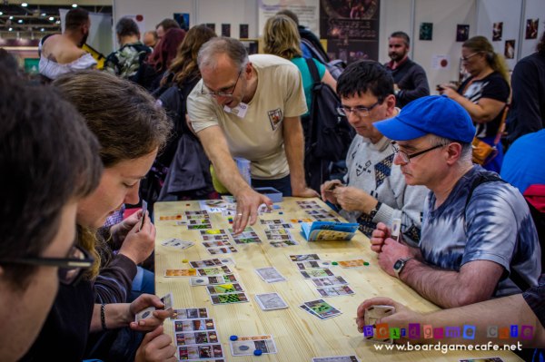 Bernd teaching some gamers how to play 